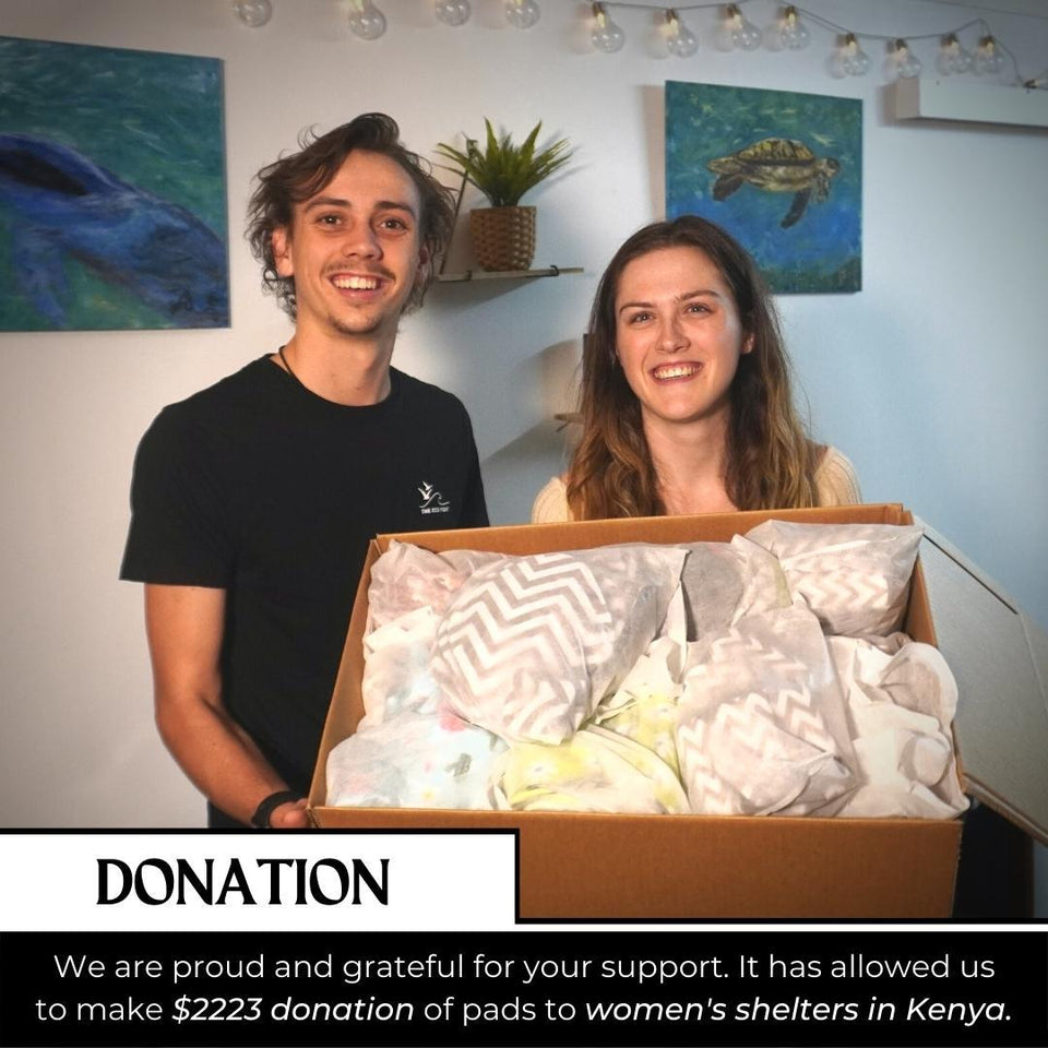 Stacy and Jackson with a box of pads donated to women's shelters in Kenya